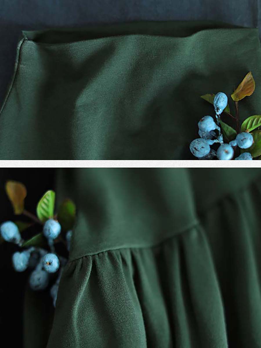 Robe à col montant drapée de couleur unie