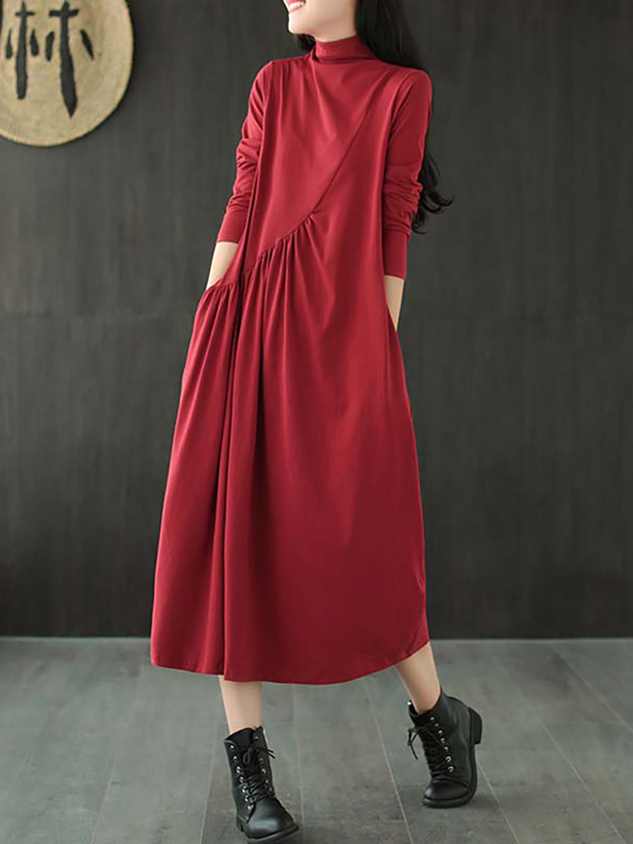 Robe à col montant drapée de couleur unie