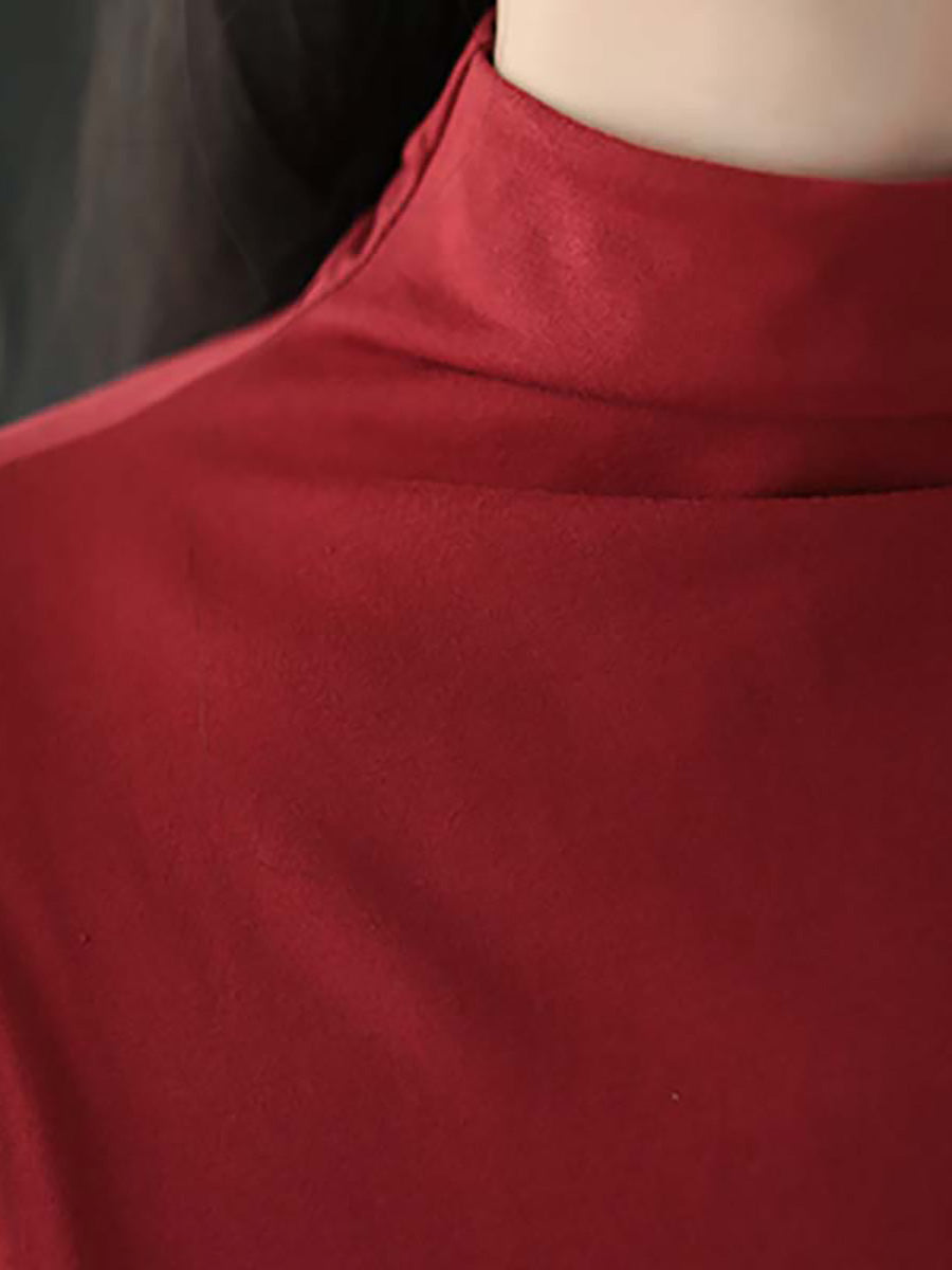 Robe à col montant drapée de couleur unie