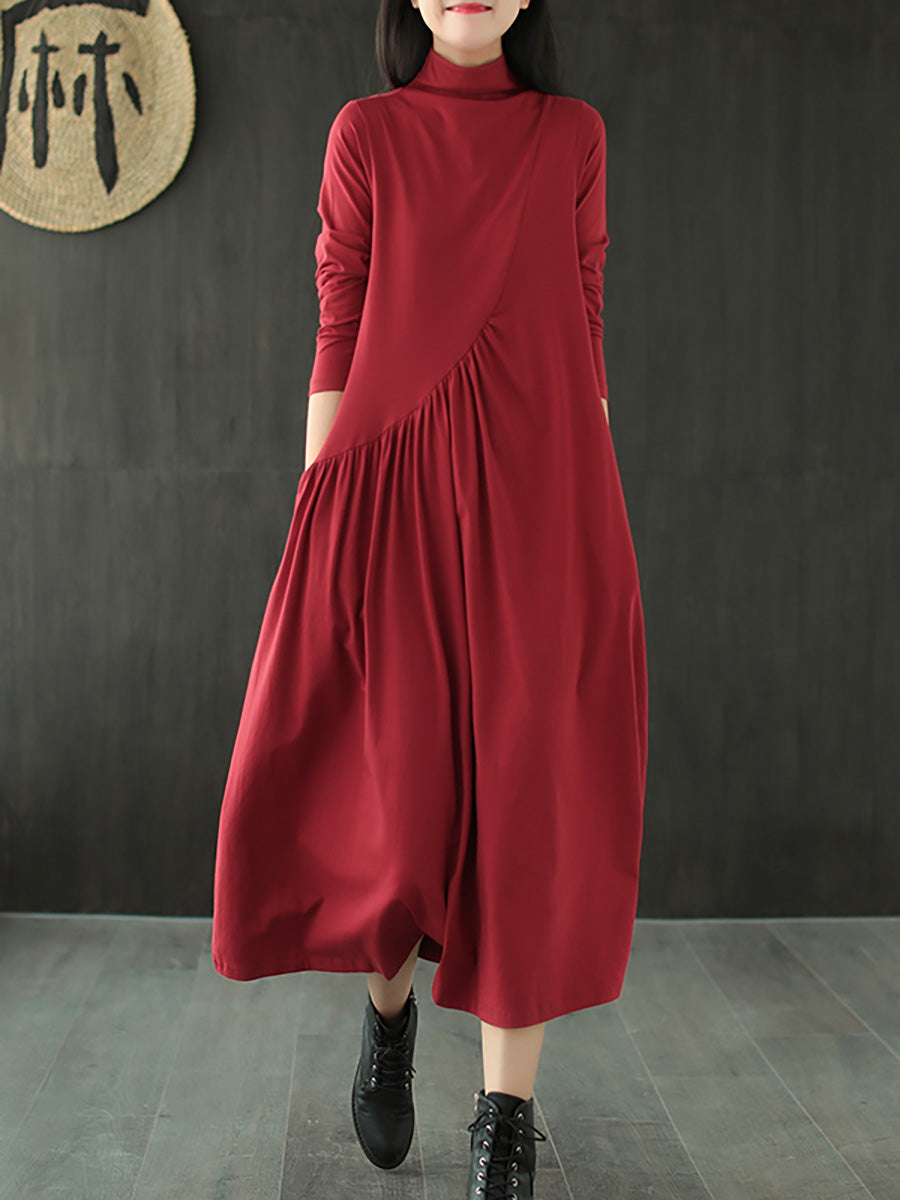 Robe à col montant drapée de couleur unie
