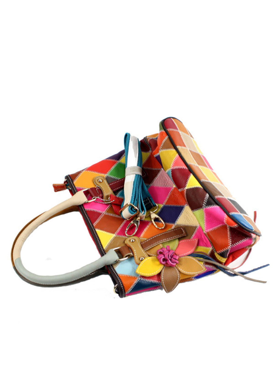 Borsa a mano da donna in pelle con fiore a contrasto di colore